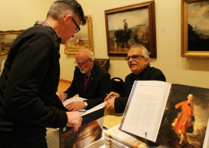 Bernard Riordan, director emeritus (left) and Terry Graff, director and editor-author of Masterworks from the Beaverbrook Art Gallery sign copies at its book launch. 