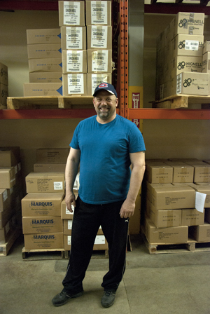 Warehouse manager Kurt Pieper keeps books from various Atlantic Canadian publishers rolling out of the Nimbus warehouse to booksellers across the country. Photo by Joseph Muise