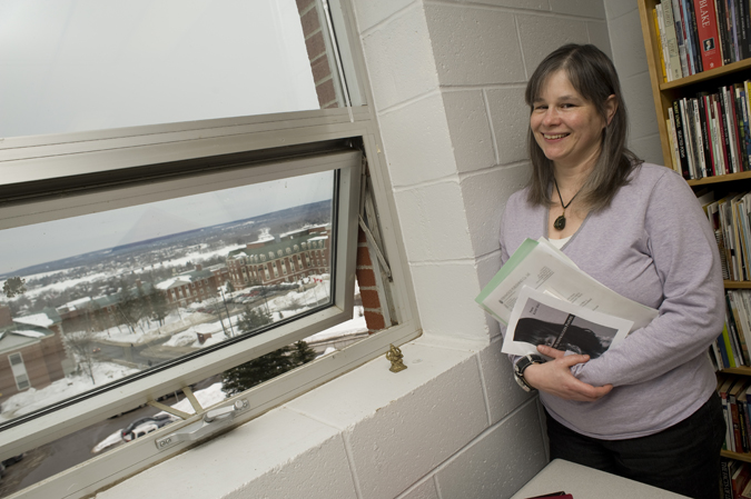 Poet Kathy Mac next to her office window at St. Thomas University. Photo credit: David Smith photo