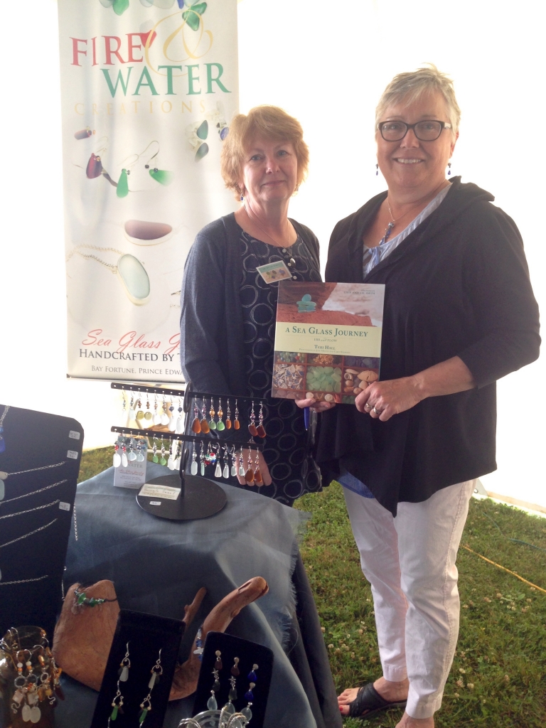 Photographer Jane Milton (L) and author Teri Hall (R) at the 7th annual Sea Glass Festival in Souris, PEI on Saturday, July 25. Photo courtesy of Nimbus Publishing.
